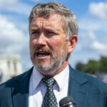 Thomas Massie speaks to reporters outside of the capitol.