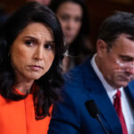 Tulsi Gabbard and John Ratcliffe speak to members of Congress in a hearing.
