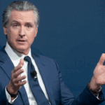 Gov. Gavin Newsom of California waves his hands in the air.