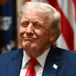 President Donald Trump smiles in a cabinet meeting