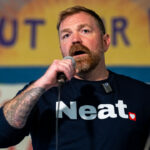 Graham Platner speaks at a rally.