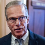Senate Majority Leader John Thune speaks to reporters in the Capitol.