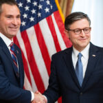 Rep. Matt Van Epps shakes hands with Speaker of the House Mike Johnson. Van Epps says socialism is "antithetical" to the Declaration of Independence.
