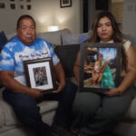 Emilio Tambunga and his daughter Elisa Tambunga sit on a couch holding pictures of their family members killed in a car crash with a human smuggler.
