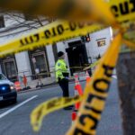 Police tape is seen at a crime scene.
