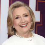 Hillary Clinton smiling at the camera.
