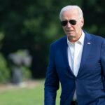 Joe Biden in a suit and sunglasses