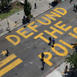 “Defund the Police” is painted on 16th Street near the White House in Washington, D.C.