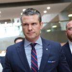 Defense Secretary-designate Pete Hegseth walks the halls of Congress