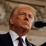 President Donald Trump scowls resolutely