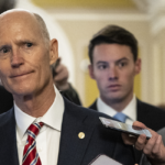 Sen. Rick Scott, R-Fla., answers questions from reporters.