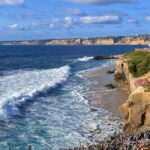 The coastline in San Diego as waves approach the beach.