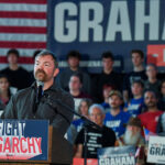 Graham Platner, Democratic candidate for U.S. Senate in Maine, speaks during a "Fighting Oligarchy" campaign rally with U.S. Senator Bernie Sanders (I-Vt.) in Portland, Maine, May 25, 2026. REUTERS/Amanda Sabga/File Photo