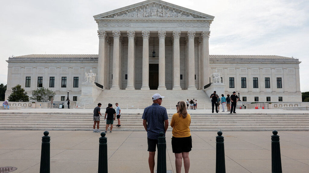 People stand outside the U.S. Supreme Court in Washington, D.C., U.S., June 22, 2026. REUTERS/Kylie Cooper/File Photo