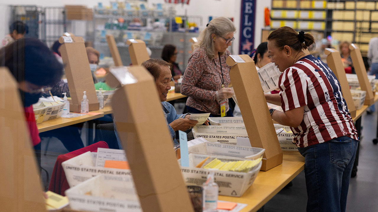 Election workers extract mail-in ballots at the registrar of voters' office during the California primary election in San Diego, California, June 2, 2026. REUTERS/Mike Blake