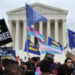 A new document suggests a parental-rights strategy from the LGBTQ movement. Pictured: a crowd protests outside a large government building, holding signs and waving flags, including a transgender pride flag and Human Rights Campaign flags. One sign reads, WE WANT TO LIVE FREE..