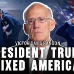 A collage with Victor Davis Hanson in the center, U.S. flag background, Donald Trump saluting, people helping a man up stairs, and bold text: President Trump Fixed America—showcasing the spirit of resilience and unity that defines America.