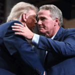 Donald Trump and Glenn Youngkin embracing.