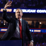 Ken Paxton waves to the crowd while standing on stage at the 2020 Republican Convention in Texas. (Kevin Dietsch/Getty Images)