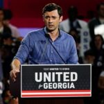 Jon Ossoff speaks at a podium featuring a sign that reads United for Georgia and Text UNITED to 51015.