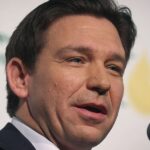 Security Guard Tackles Protester at DeSantis Event in Iowa