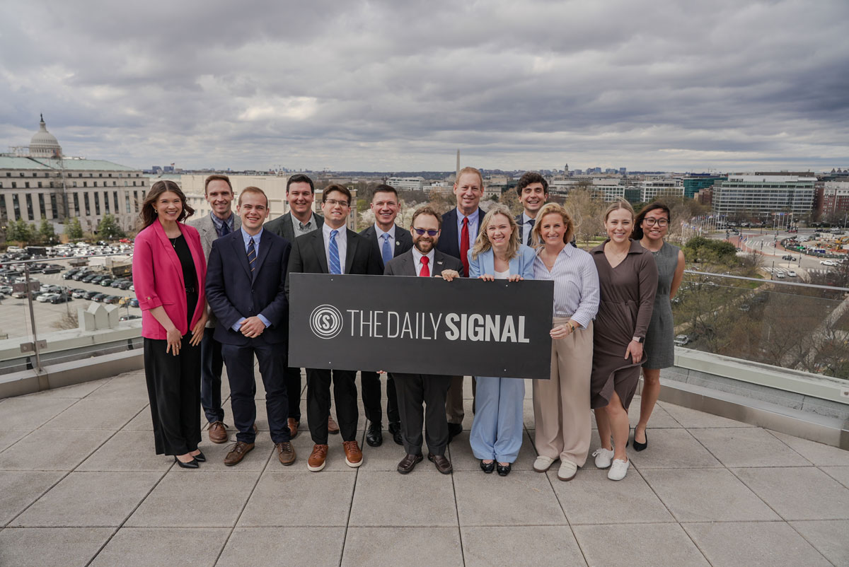 Photo of Daily Signal staff on a rooftop overlooking Washington, D.C.