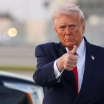 President Donald Trump offers a thumb's up, with his limousine parked behind him.