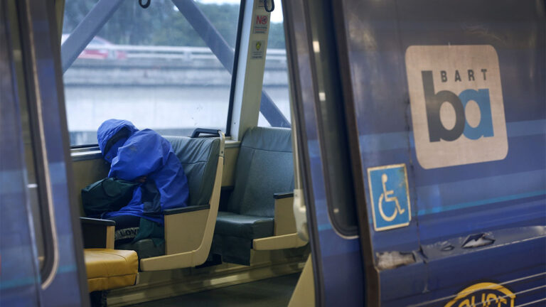 A passenger naps on a train at the MacArthur BART station in Oakland, Calif. on Tuesday, May 12, 2020. BART is joining transit agencies from around the country in seeking economic federal relief funds because of dwindling ridership during the coronavirus shutdown. (Photo By Paul Chinn/The San Francisco Chronicle via Getty Images) Crime