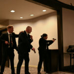 Agents with their guns drawn at Washington Hilton.