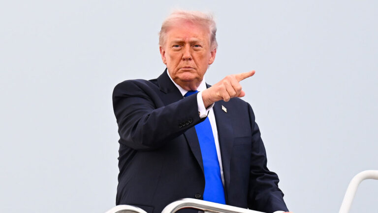 Donald Trump against light blue sky points.