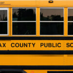 Side of a yellow Fairfax County Public Schools bus.