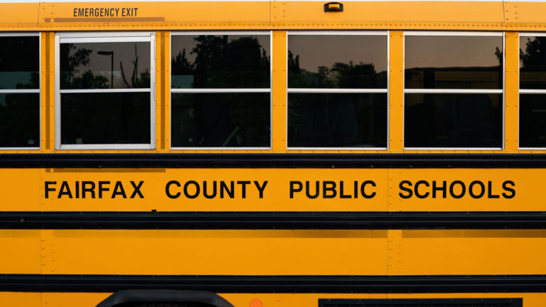 Side of a yellow Fairfax County Public Schools bus.