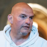 Close-up of John Fetterman in a white hoodie.
