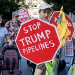 Climate activists march across the Brooklyn Bridge to demand that New York Governor Kathy Hochul stop the construction of the Williams Pipeline. Protests against this pipeline have previously shut down the pipeline that supplies fracked gas. (Photo by Michael Nigro/Pacific Press/LightRocket via Getty Images)