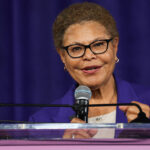 Los Angeles Mayor Karen Bass at a podium.
