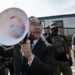 U.S. Sen. Andy Kim (D-NJ) tries to broker a de-escalation between ICE agents and immigration activists outside of Delaney Hall on May 25, Memorial Day in Newark, New Jersey. Activists had come to support immigrants detained at the Delaney Hall who are participating in an inmate hunger strike over detention conditions as the strike continued into the fourth day. (Photo by Stephanie Keith/Getty Images)