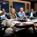 Barack Obama and Joe Biden at a table with Hillary Clinton, James Clapper, Leon Panetta and other officials.