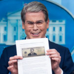 UNITED STATES - MAY 28: Treasury Secretary Scott Bessent holds a printout of a proposed $250 bill featuring a picture of President Donald Trump, during the White House press briefing where he addressed Trump Accounts, the war in Iran, and inflation among other issues, on Thursday, May 28, 2026. (Tom Williams/CQ-Roll Call, Inc via Getty Images)