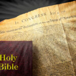 The Bible rests on a copy of the Declaration of Independence