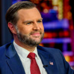 Close-up of a smiling JD Vance on the set of "Gutfeld!"