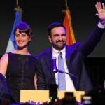 Zohran Mamdani and wife Rama Duwaji wave to crowd election night.
