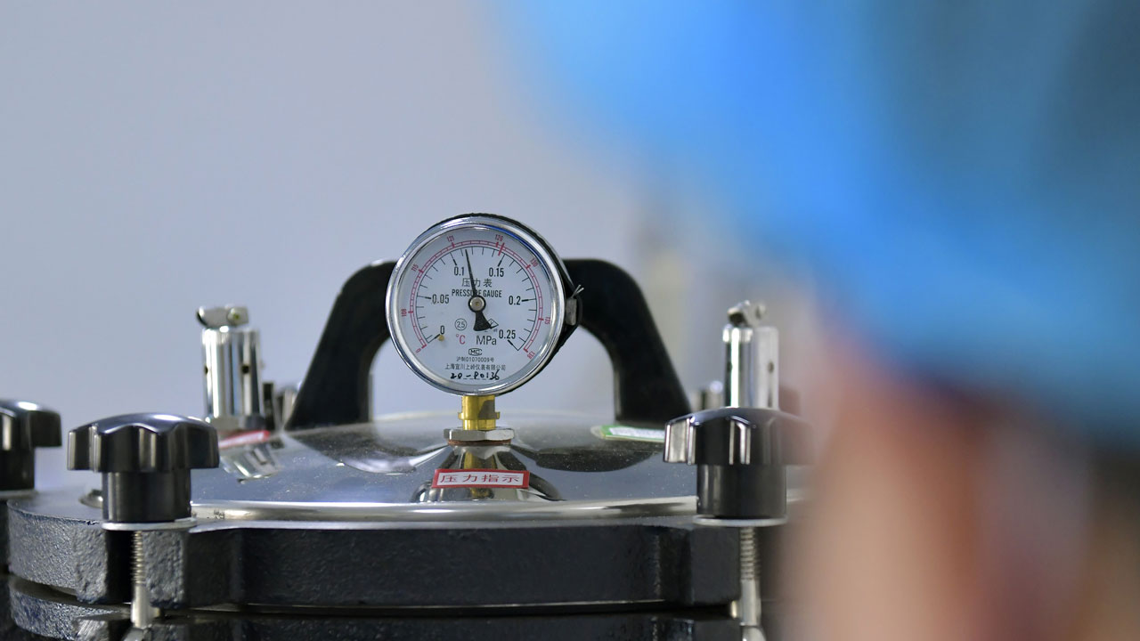 A technician works at the laboratory of a pharmaceutical packaging material enterprise in Cangxian County, north China's Hebei Province, Sept. 9, 2021. There are more than 1,000 pharmaceutical packaging materials manufacturers in Cangxian County. (Photo by Luo Xuefeng/Xinhua via Getty Images)