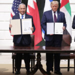 President Trump, Israeli Prime Minister Benjamin Netanyahu and the foreign ministers of Bahrain and the UEA hold up signed copies of the Abraham Accords during White House Ceremony.