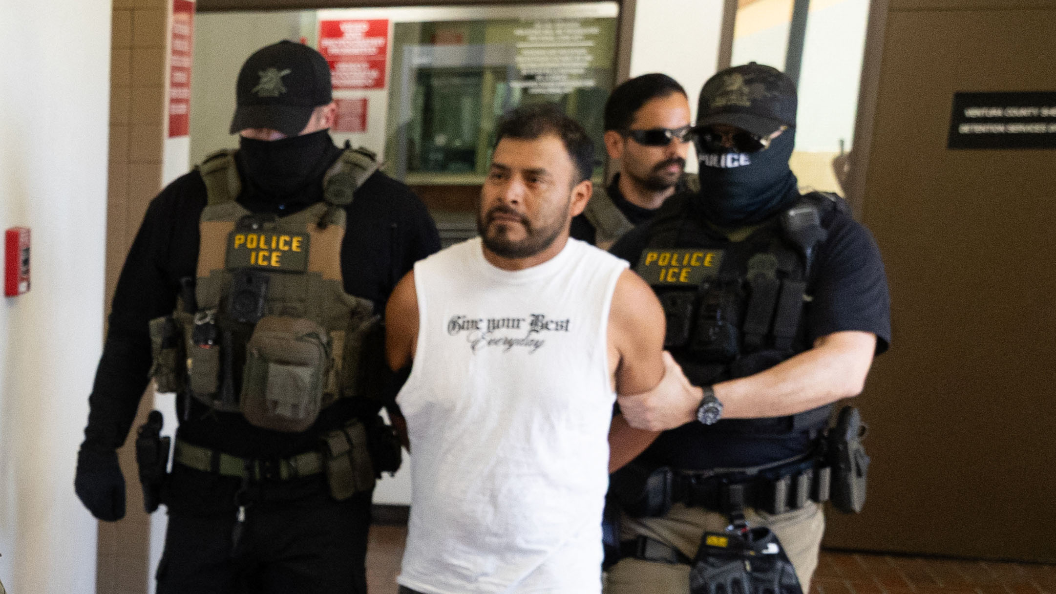 Immigration and Customs Enforcement agents walk a detainee out of the Ventura County Government Center in Ventura, California, on July 27, 2026. (Blake Fagan / AFP via Getty Images)