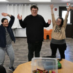 From left, Natalie Baker, a board certified behavior analyst (BCBA), Ethan Ortengren, 18, who has autism, Sayeena Normanleier, a registered behavior technician (RBT), and Dezart Stover, a behavior technician (BT), watch a roller coaster video to help Ethan with movement during therapy at Seven Dimensions Behavioral Health in Evergreen, Colorado, on March 16, 2026.