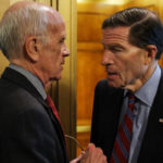 Sen. Peter Welch (D-VT) and Sen. Richard Blumenthal (D-CT) speak outside of the Senate Chambers.