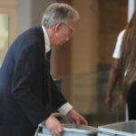 Former U.S. Ambassador to the United Nations and former National Security Advisor John Bolton walks through security as he arrives for a plea deal hearing at U.S. District Court for the District of Maryland on June 26, 2026 in Greenbelt, Maryland. Bolton is expected to plead guilty to one count of mishandling national security information. (Photo by Al Drago/Getty Images)