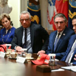 US Secretary of Education Linda McMahon, US Secretary of Health and Human Services Robert F. Kennedy Jr., US Secretary of the Interior Doug Burgum, US Secretary of State Marco Rubio look on as US President Donald Trump.