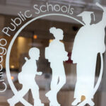 A sign is displayed on the front of the headquarters for Chicago Public Schools.