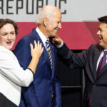 Former Vice President Joe Biden, center, shares a laugh with congressional candidates, Katie Porter, left, and TJ Cox, right.